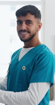 Man, nurse and face at clinic with smile for career for pride, confidence and medical services. Person, caregiver and happy in portrait for telehealth, tech or application at hospital in Colombia
