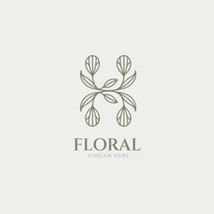 Elegant minimalist H letter floral logo design featuring a symmetrical vine with buds and leaves forming for luxury beauty branding