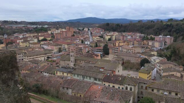Panoramic view of the modern district of Colle di Val d'Elsa, Tuscany, Italy, featuring contemporary architecture, residential buildings, and the scenic Elsa valley landscape
