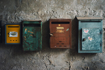Old rusty mailbox on old wall