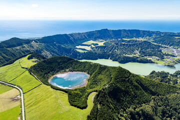 Volcanic caldera landscape with twin lakes on Sao Miguel Island in Azores, drone footage