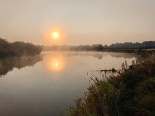 Fototapeta premium Fog over the Dnieper River, autumn landscape with sunrise.