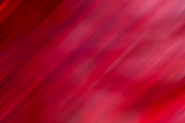 Abstract red diagonal blur background with vibrant tones and dynamic energy for design projects