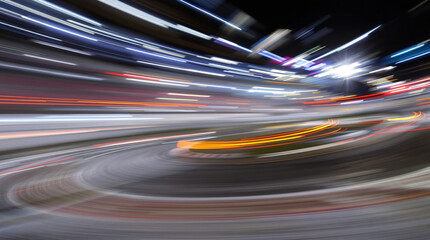 Night illuminated racing track asphalt surface turn on motion blur