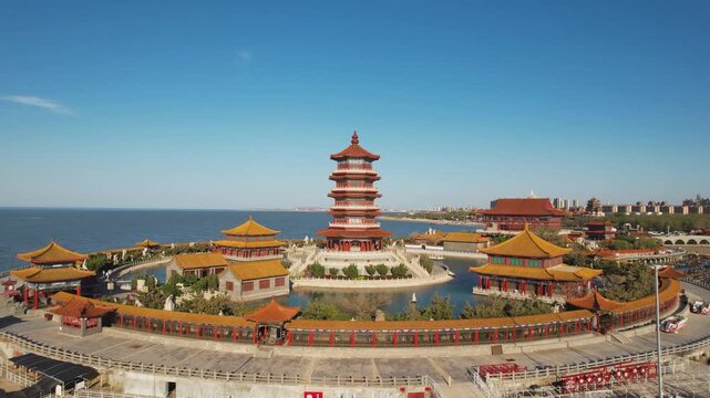 Traditional Chinese Pagoda and Temples Overlooking Coastal City