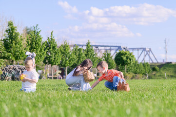 Kids Hunting Easter Eggs Outdoors on Sunny Spring Day