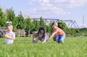 Kids Hunting Easter Eggs Outdoors on Sunny Spring Day