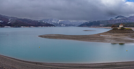 canoeist on Lake Serre de Pon&ccedil;on from the Saint-Michel chapel in France 
