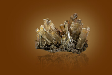Crystals on a druse with a dark orange background.