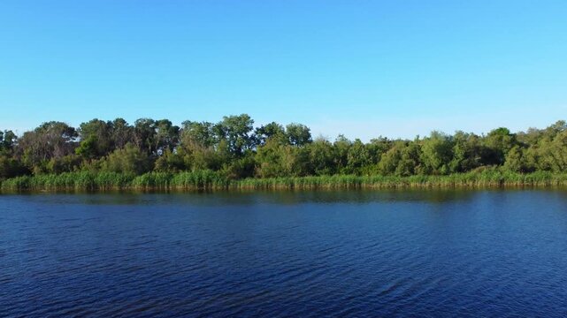 Fisherman in action when fishing in the lake, Algeria, fishing boat traditional and net.