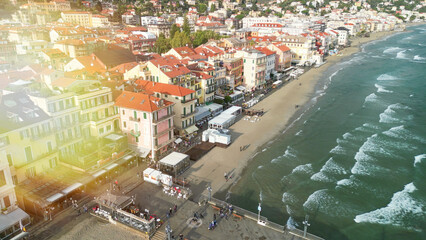 Drone perspective of Alassio shoreline during winter season with empty sandy beach