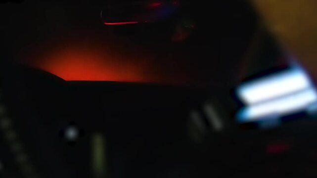 Inside Patrol Car With Flashing Red and Blue Lights at Night