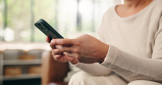 Hands, phone and texting on sofa in home with contact, scroll or notification with web chat in lounge. Person, smartphone and click with mobile app, relax and social media in living room at apartment