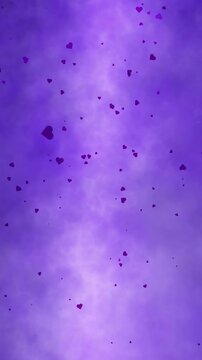 Small purple hearts falling and slowly rotating in random motion against a soft glowing violet gradient background with subtle light haze. Vertical seamless looping.