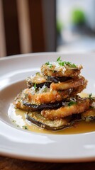 Stack of crispy fried eggplant slices with fresh parsley and grated cheese on a white plate, served with a savory sauce, conceptual food art.
