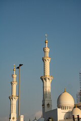 Minaret and Dome of Mosque Against Clear Blue Sky