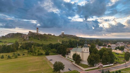 Castle ruins in Olsztyn near Częstochowa captured in golden hour light, aerial drone view over limestone rocks and historic fortress in Poland © Konrad Kerker