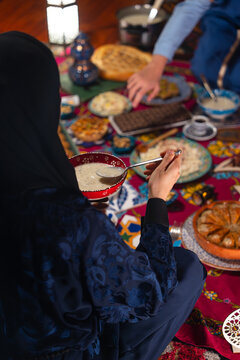 Ramadan Backround Photo, Muslim Family Having Dinner At Home. Iftar Table with Traditional Food. Fasting ends with Dates. Ramadan Feast Celebrations, Uskudar Istanbul, Turkiye (Turkey)