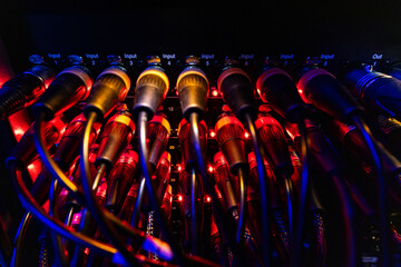Professional Audio XLR Connectors and Cables with Red Indicators on Patch Panel