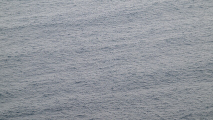 Calm ocean surface with gentle ripples background