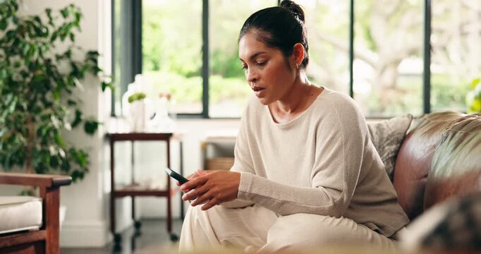 Woman, phone and stress with texting on sofa for bad news, scamming or anger in living room at house. Person, smartphone and frustrated with online dating, social media and mobile app at apartment