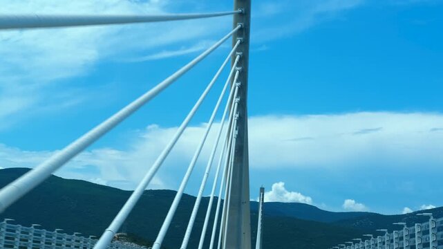 Driving across the modern peljesac bridge in croatia. Point of view from a car driving over the impressive cable-stayed peljesac bridge, connecting the croatian mainland with the peljesac peninsula