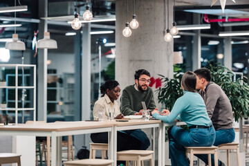 Diverse startup team collaborating brainstorming ideas in modern office