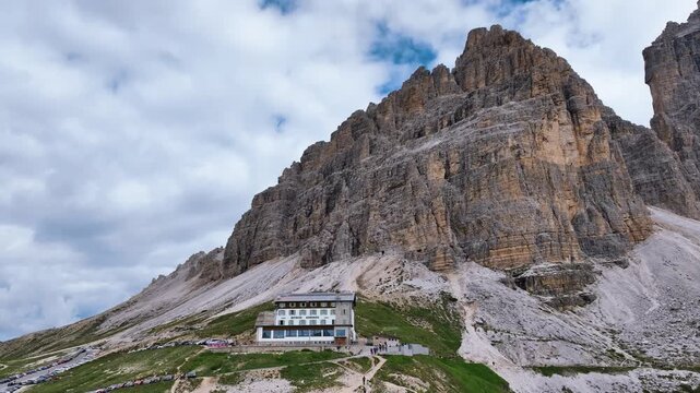 A scenic view of the Dolomites mountain range in Italy, specifically focusing on the Tre Cime di Lavaredo. 
