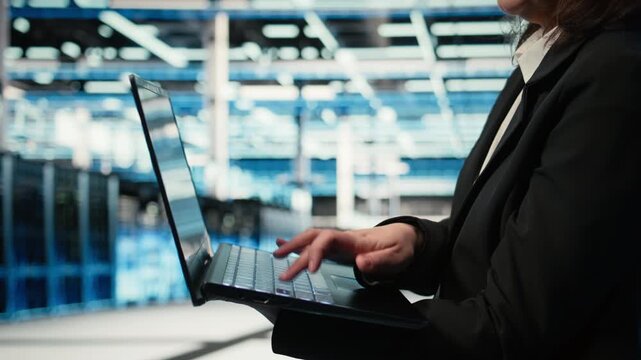 Close up of laptop software used by data center admin to troubleshoot supercomputers issues. Server farm employee analyzing system logs with notebook to resolve electronics errors, camera A