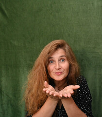 Woman with long hair on a green background,