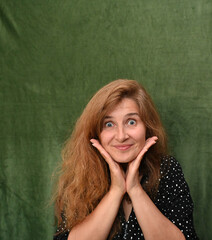 Woman with long hair on a green background,