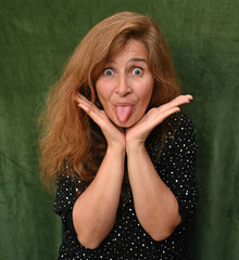 Woman with long hair on a green background,