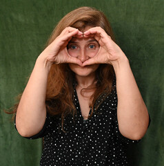 Woman with long hair on a green background,