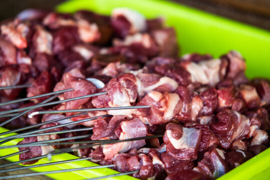 Authentic Indonesian Mutton Satay Klatak Grilling on Iron Skewer over Hot Charcoal, Traditional Lamb Skewers with Salt Seasoning, Asian Gastronomy and Street Food Cooking Process Close Up