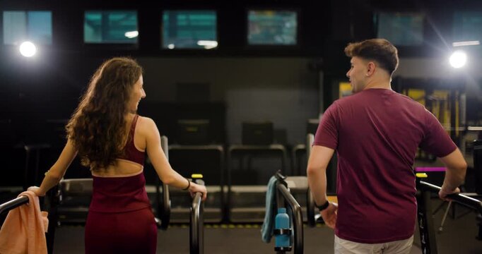 Friends join together for exercise at fitness center with teamwork and support in a group activity during workout session