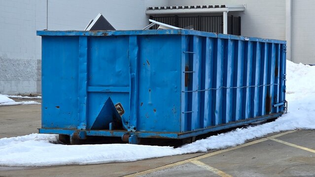 Large Roll Off Dumpster Full of Trash Metal Garbage Container Black Waste Heap Pick Up Delivery Collection Service Construction Renovation Municipal Recycling Management Containment Blue