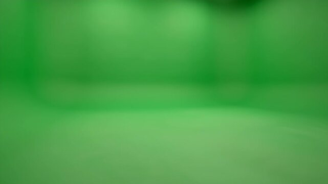 A softly blurred green background with subtle light variations