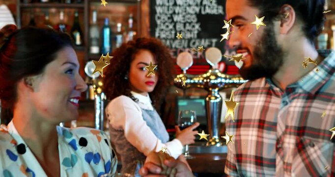 Pair exchanging fist bump in bar, sparking stars sweeping taps while woman sipping from wine glass