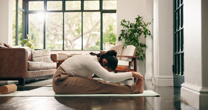 Stretching, yoga mat and woman in morning for health, wellness and mobility exercise in home. House, floor and person with practice, hobby and fitness routine for posture, flexibility and balance