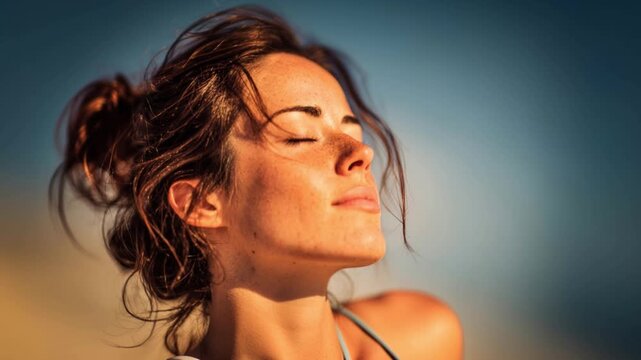Serene woman soaking up sunlight for vitamin D and natural wellness. Slow motion.