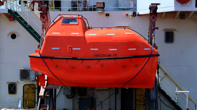 Orange Lifeboat Hanging on Ship Deck for Maritime Safety and Emergency Rescue Equipment