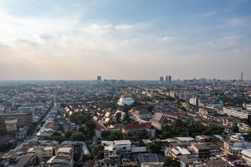 Obraz premium An aerial perspective offers a breathtaking view of Wat Saket, the temple standing tall amid the hustle and bustle of Bangkok's housing. shot date 6 Nov 2018.