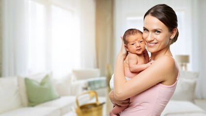 Loving mother holds newborn baby in bright, cozy living room
