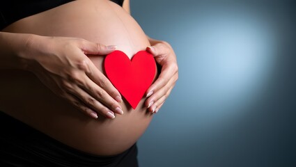 Expecting Mother Holding Red Heart Shape on Pregnant Belly