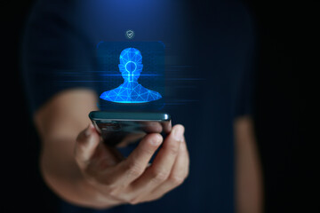 Facial recognition security concept. Digital face scan and biometric identity hologram emerging from smartphone, representing face authentication, AI recognition, data privacy, secure mobile access.