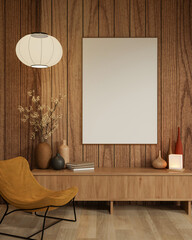 White frame and round lamp on wooden wall over table an yellow fabric accent chair on parquet floor.