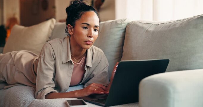 Freelancer, typing and woman with laptop, lounge and creative for article on website and journalism. Reporter, online and person with tech for research on couch, editing and remote work in house