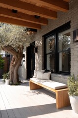 A picturesque outdoor seating area featuring a charming wooden bench nestled next to a lovely olive tree, bathed in the warm glow of daytime, located in a serene residential neighborhood