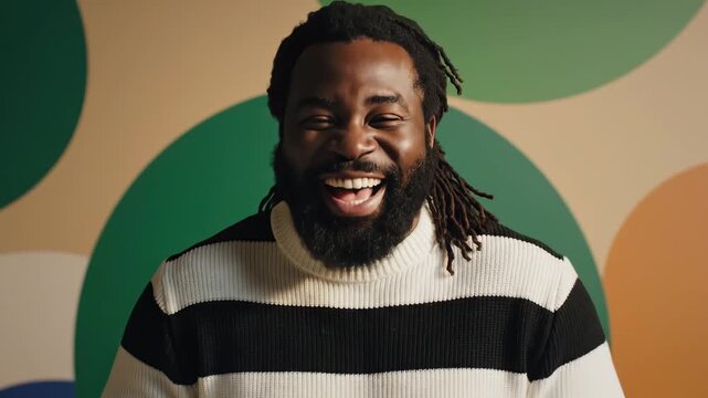 Laughing man with beard and dreadlocks