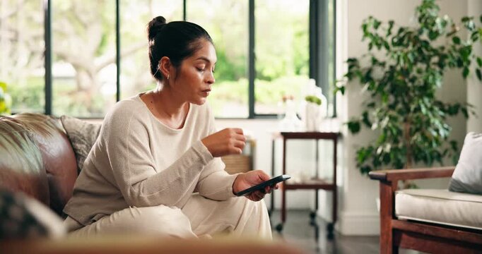 Woman, phone and stress with texting on couch for bad news, scam and anger in living room at house. Person, smartphone and frustrated with online dating, social media and mobile app at apartment